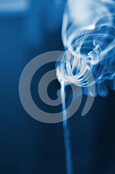 The smoke from the incense sticks. Abstract art. Soft focus. Color of the year 2020 Classic Blue.