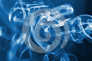 The smoke from the incense sticks. Abstract art. Soft focus. Color of the year 2020 Classic Blue.