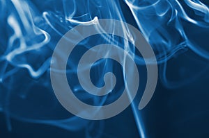 The smoke from the incense sticks. Abstract art. Soft focus. Color of the year 2020 Classic Blue.