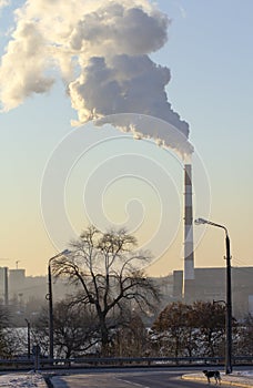 Smoke from industrial chimneys against the blue sky. Pollution