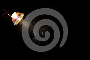 Smoke in the light of a bulb