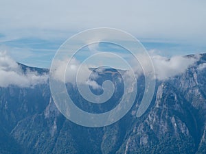 Smoke like clouds over Bucegi mountains, Romania