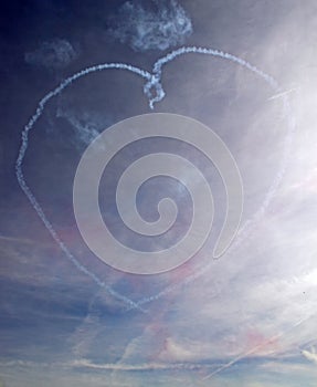 A smoke love heart in a blue sky photo