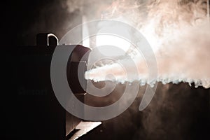 Smoke machine in action. Smoke in the dark.
