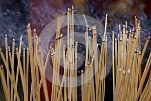 Smoke from many incense sticks that burning and embroidered in incense burner, Buddhists pray to be happy in the new year and ward