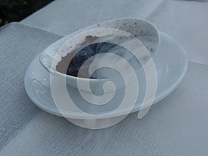 Smoke on an outdoor restaurant table as a wasp deterrent