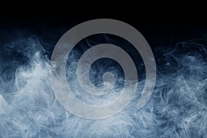 Smoke over black background. Fog or steam texture.