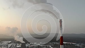 Smoke from the pipes of a thermal power plant. Two chimneys from a thermal power plant.