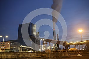 Smoke from power plant at the Maasvlakte Harbor during sunset