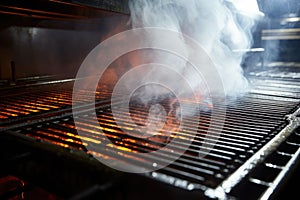 smoke rising while grates getting scrubbed