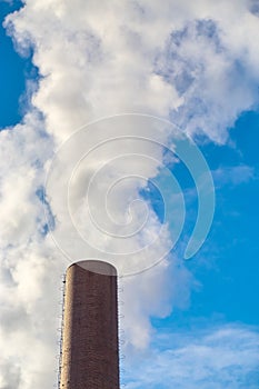 Smoke rising from industrial chimney