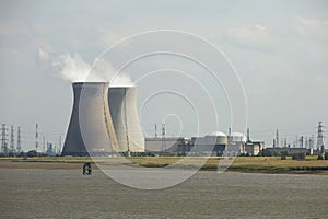 Smoke rising from industrial chimney in energetic factory.