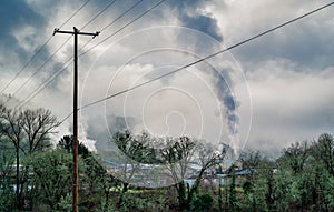 Smoke rising from a timber yard as seen while driving away from Roseburg, Oregon, USA