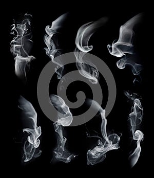 Smoke set isolated on black background. White cloudiness, mist or smog background. Smoke collection for your design