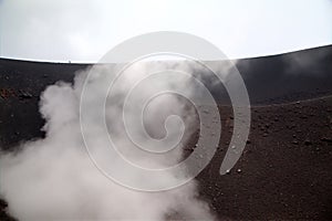 Smoke at Silvestri crater of Etna volcano.