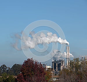 A smoke stack at an oil refinery