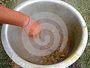 Smoke and steam coming out when Cooking chicken mutton meat at an Indian field with firewood oven