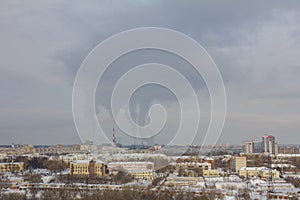 Smoke tubes in skyline - Industrial landscape at winter snow city