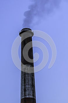 Smoke tunnel, tall industrial factory chimney.