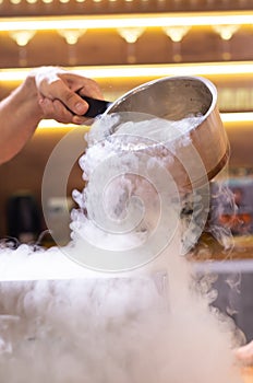 Smoke vapor dry ice in bowl in kitchen