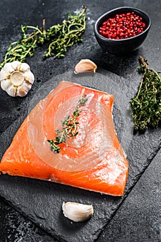 Smoked Atlantic salmon fillet. Organic fish. Black background. Top view