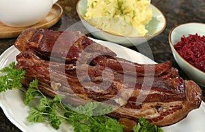 Smoked bacon cooked and served with mushed potatoes
