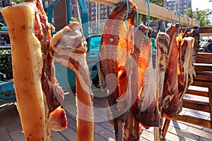 Smoked bacon and fish on the chinese street in Hangzhou city