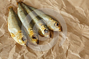 Smoked Baltic herring fish on paper