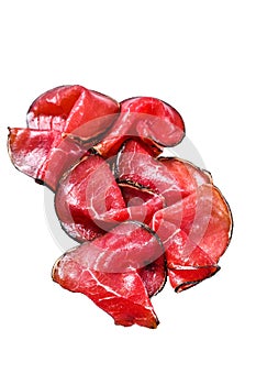 Smoked bresaola beef cut pieces, Italian Antipasti. Isolated on white background, Top view.