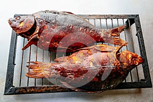 smoked carp on metal grill