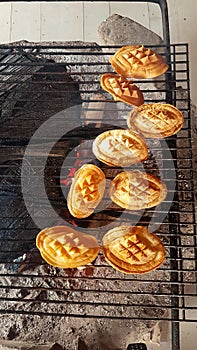 A smoked cheese made of salted sheep milk exclusively in the Tatra Mountains, Poland (oscypek) getting grilled