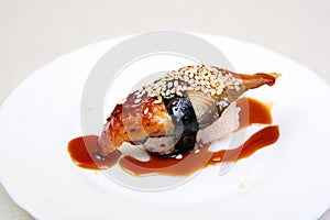 Smoked eel with gravy and cucumber. Sashimi Unagi. Japanese food on a beautiful dish. Dietary food. An exquisite