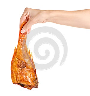 Smoked fish perch in hand