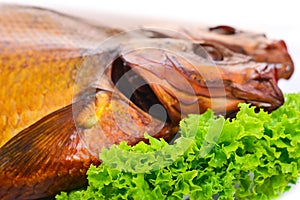 Smoked fish on plate close up