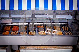 smoked fish is sold on a fishing boat