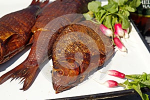 Smoked fish with young radish and parsley