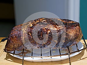 Smoked and grilled beef eye of round pulled from the heat