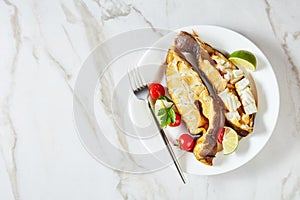 Smoked halibut steaks on a marble background