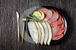 Smoked halibut and tuna slices, top view, close-up