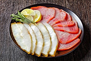 Smoked halibut and tuna slices, top view, close-up