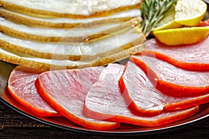 Smoked halibut and tuna slices, top view, close-up