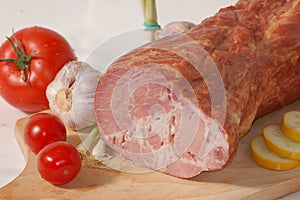 Smoked ham on the bread-board