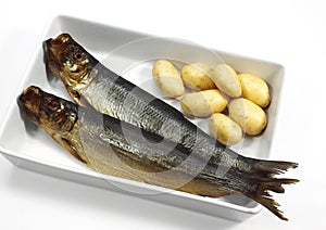 Smoked Herring or Bouffi Bloaster, clupea harengus, Smoked Fishes with Potatoes