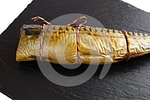 Smoked mackerel on a stone board.