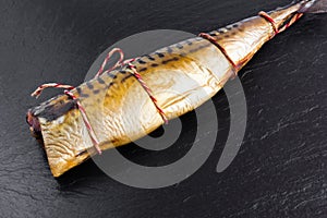 Smoked mackerel on a stone board.