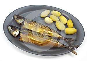 SMOKED MACKERL scomber scombrus WITH POTATOES ON A PLATE