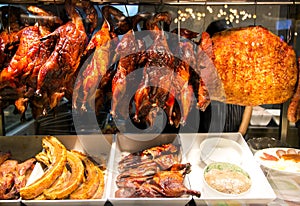 Smoked meat of bird and pork in food hall at the Siam Paragon