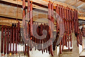 Smoked meat hanging in the smokehouse
