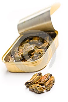 Smoked mussels in opened tin can