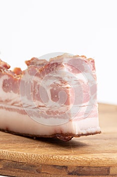 Smoked Pork Bacon Slice On The Wooden Board